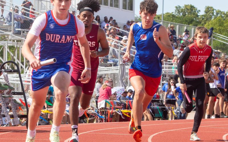 Durant Lions Carter Kemp and Madison Roper compete in the track meet last week at Durant High School.