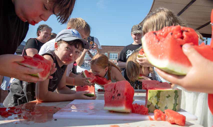 ABOVE: The Durant Magnolia Farmers Market Watermelon Jamboree was Saturday morning at Market Square and there was a watermelon eating contest and seed-spitting contest. The Farmers Market continues on Saturdays from 8 a.m. until noon through Oct. 31. See more pictures on page 10.