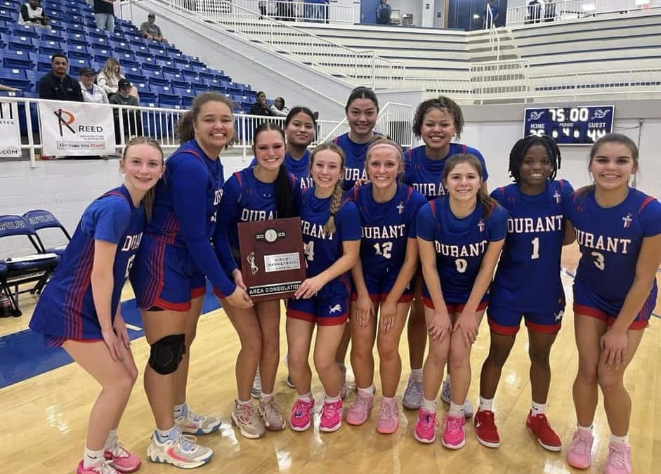The Durant Lady Lions basketball team poses after defeating Pryor on Friday in Sapulpa. They now will be on their way to the state tournament. 