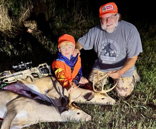 Ben Smith is shown with his grandfather Mark Swearengin after a successful deer hunt last season when Ben harvested his first deer with a crossbow. Photo provided