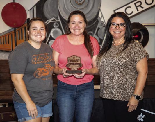 Two of a Kind Thrift store on Main Street in downtown Durant received the Best Window Display award for their display during the recent rodeo parade. The award was presented at last week’s Durant Main Street annual members meeting at Three Valley Museum. From left, Sierra Dillon and her mother Amanda Forsberg of Two of a Kind Thrift, and Melisse Prentice, outgoing Durant Main Street president. Matt Swearengin | Durant Democrat