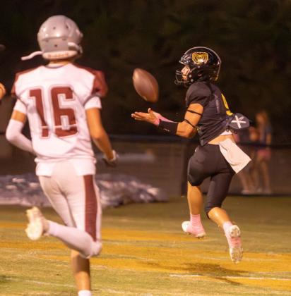 Caddo Bruin Jake McKay is about to catch the ball for a touchdown and also shown is Velma-Alma Comet Daer Bertsch.