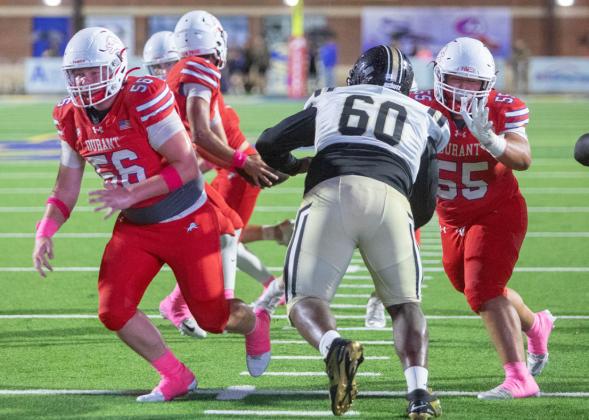 The Durant Lions played Midwest City last Friday and shown are Drew Vanisacker and Chris Hix.