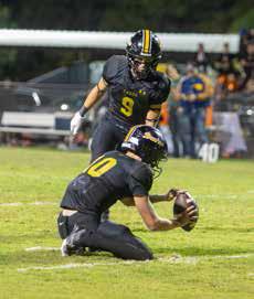 Caddo Bruin Jake McKay is about to kick the ball held by Cale Wigington during a game last season. McKay has a possibility of being quarterback. Matt Swearengin | Durant Democrat