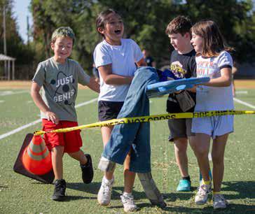 The Durant Fire Department visited Washington Irving and other elementary schools last week to educate children about September 11th and give them the opportunity to handle fire department equipment. From left, Jason Roby, Madi Davenport, Kash Buchanan and Tresa Richardson. Matt Swearengin | Durant Democrat
