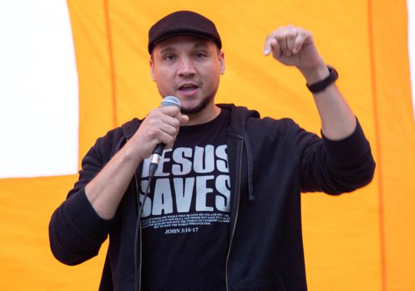 Hearts Transformed Ministries had a campus worship night April 29 at the Southeastern Tailgate Alley. The event included free food and a car giveaway. Shown speaking is Pastor Anderson Reign. Matt Swearengin | Durant Democrat