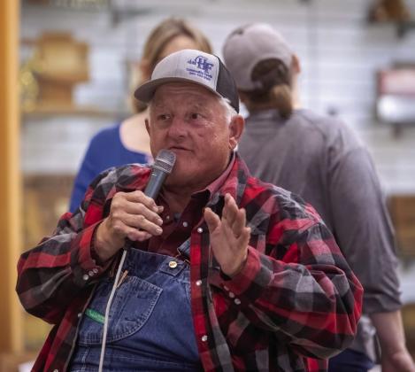 Auctioneer John Teel, who died May 29, often was the auctioneer for fundraising events, including the Durant High School Band homemade goods auction in 2024. Matt Swearengin | Democrat file photo
