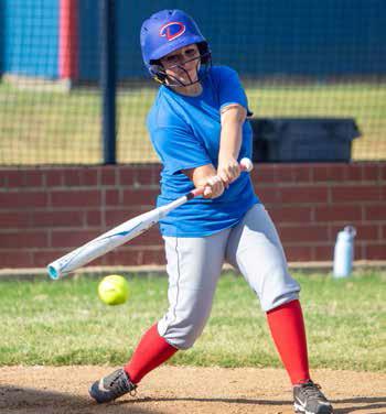Lady Lion Grace Meaders swings at the ball during a recent practice. Matt Swearengin | Durant Democrat