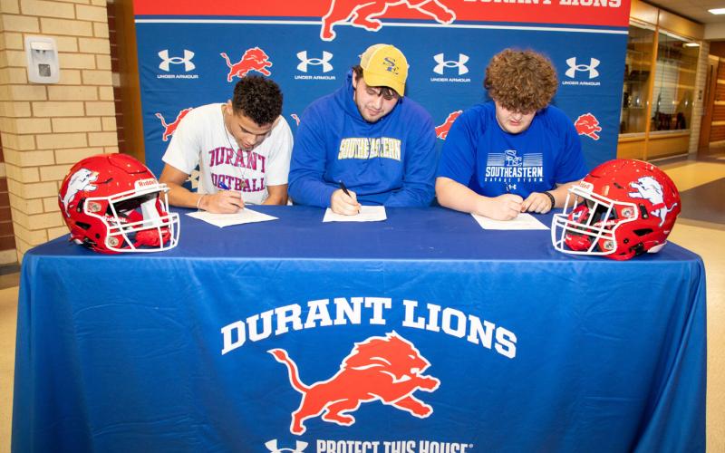 Durant Lions Kaydon Mimms, Tucker Dry and Carson Allivand signed scholarships last week to play football in college. Allivand and Dry will attend Southeastern while Mimms is heading to the University of Central Oklahoma. Matt Swearengin | Durant Democrat