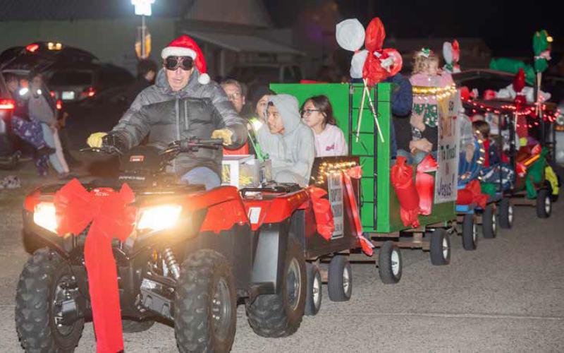 People ride in the Calera Christmas Parade.