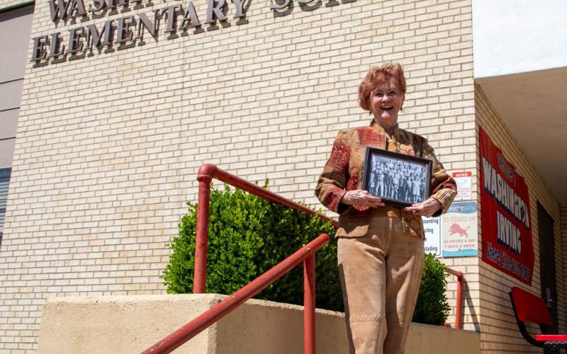 Dr. Melinda McClanahan poses at Washington Irving Elementary School where she attended 76 years ago. She is the younger sister of “The Golden Girls” actress Rue McClanahan. Matt Swearengin | Durant Democrat