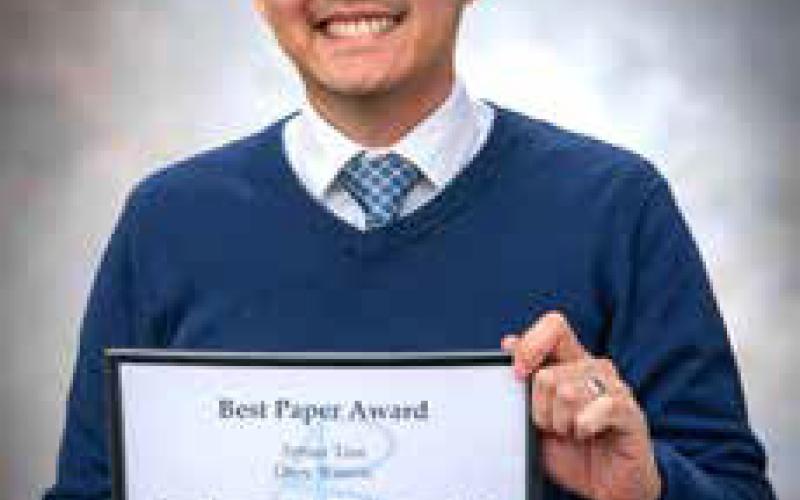 Dr. Arthur Tran with his award for “Best Paper” from the Academy of Business Research Fall Conference. Dan Hoke | SE