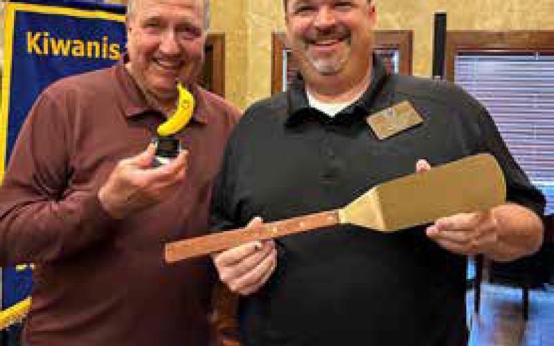 Awards were given to Kiwanis Pancake Ticket top salesmen. The Top Sales title went to Tommy Kramer, not shown. The coveted Golden Spatula Award was given to Jason Manous, right, leader of the winning sales team. Top Banana Award for top sales for the second-place team was presented to Bart Rustin, left.