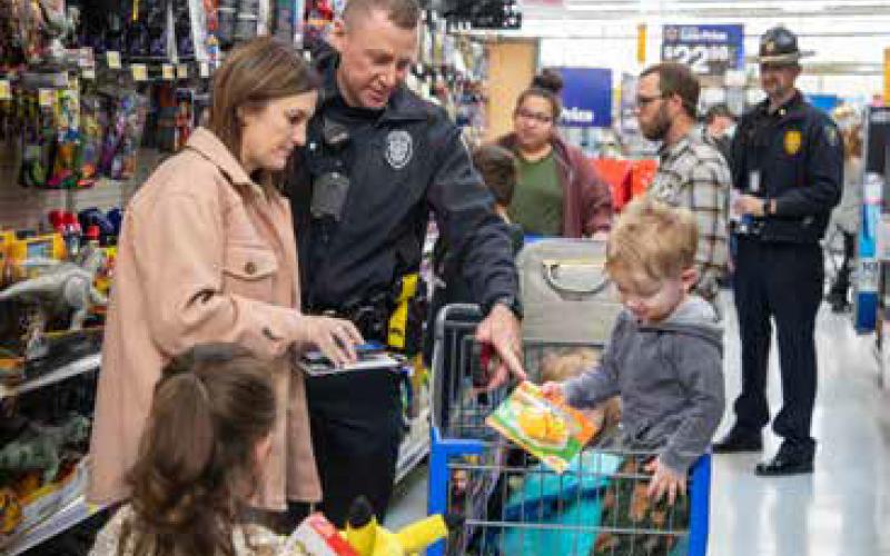 Police take children on shopping spree during Shop with a Cop
