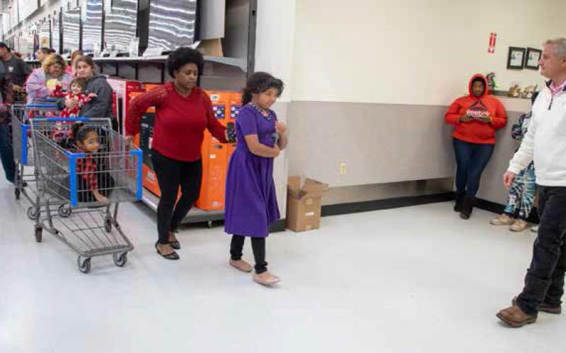 Police take children on shopping spree during Shop with a Cop