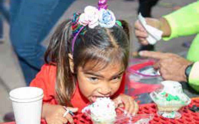 Ellerie Sheffield enjoys a cupcake during the Early Childhood Center Christmas Carnival.