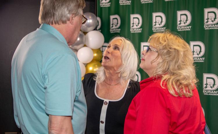Pam Polk, who began her duties April 5 as Durant city manager, talks to Mike and Charlene Ridgway during a welcome reception April 11 at the Donald W. Reynolds Community Center &amp; Library. Matt Swearengin | Durant Democrat