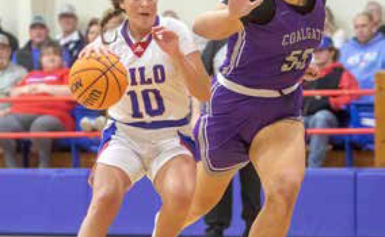Silo Lady Rebel Kynleigh Pierce dribbles down court next to a Coalgate player. Silo won the game. Matt Swearengin | Durant Democrat