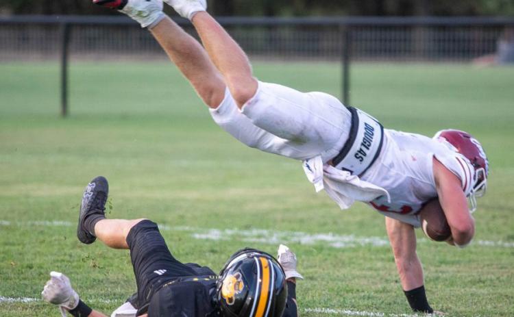 A Waurika Eagle goes down with the ball in a recent game with the Caddo Bruins. Matt Swearengin | Durant Democrat