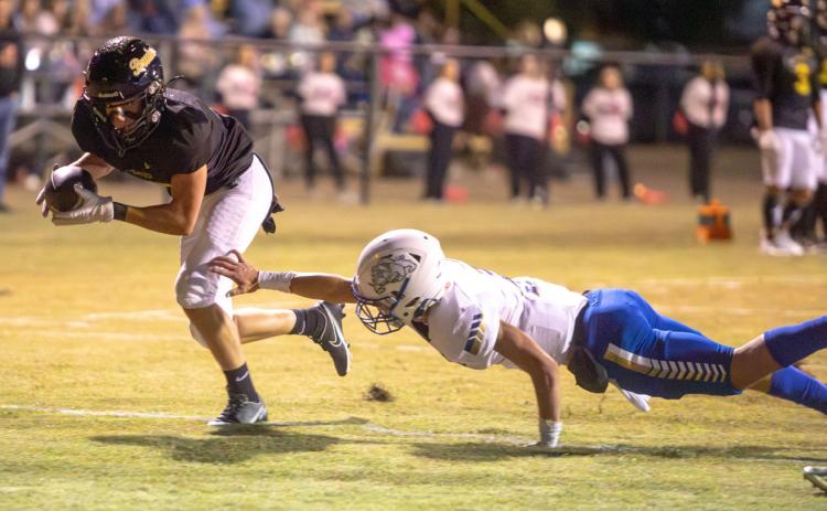 Caddo Bruin Jake McKay escapes a tackle by a Savanna player during an October home game. Matt Swearengin | Durant Democrat