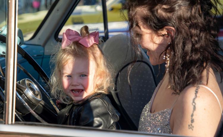 Durant Main Street had its annual Trick or Treat on Main on Halloween. Kimberly Currens and her daughter Kinsley Mae Nelson sat in a 1950s car that was a part of the Blast from the Past car club’s display of antique automobiles. Matt Swearengin | Durant Democrat