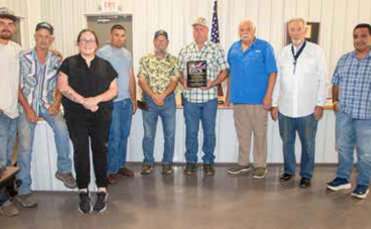 Caddo has been designated a Purple Heart Town and a plaque was presented during a council meeting last week. Shown are council members Garrett Schafer, Eddie Ervin and Abby Owen, Dwight Gould, Curtis Cheramie, Mayor Lindal White, Daniel Earley, Yates Canipe and Steve Byrd. Matt Swearengin | Durant Democrat