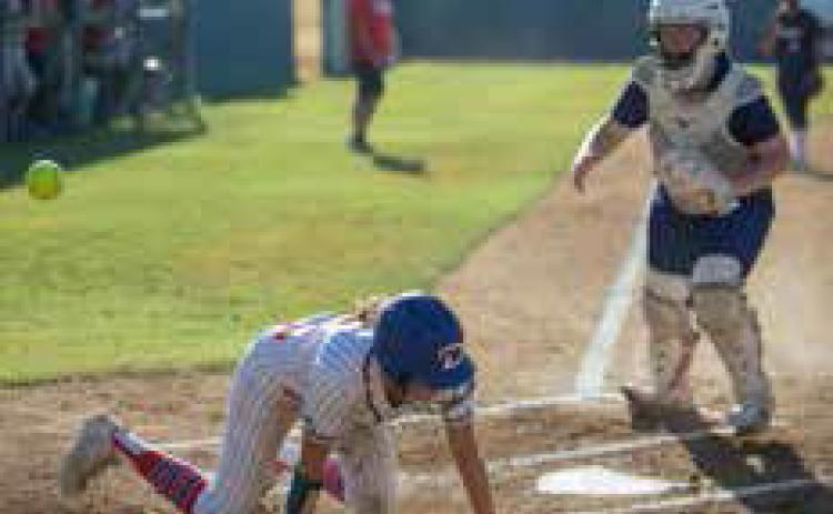 Lady Lion Anslee Morse makes it to home plate in the game with Shawnee. Matt Swearengin | Durant Democrat