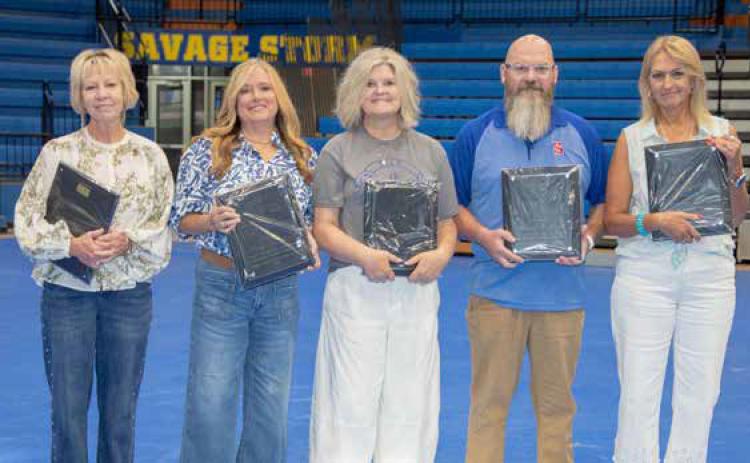 Educators with 35 years or more of service were honored during the recent Bryan County Teachers’ Meeting at Southeastern Bloomer Sullivan Arena. From left, Marsha Cunningham, Tracy Rowland, Anita Self, Steve O’Steen and Sheila Long. Matt Swearengin | Durant Democrat