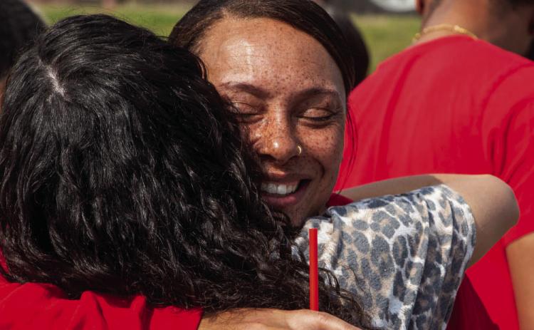 Sabrina Ford embraces in 2021 during the dedication of a memorial monument for the four Durant High School students who died after their car was struck by a pickup driven by a drunk driver on Memorial Day weekend 2020. Her son, Hunter Ford, was among the teens who died, and Sabrina Ford passed away this week. File photo | Matt Swearengin