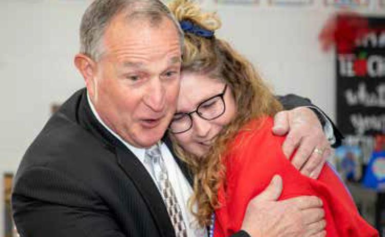 Durant Schools Superintendent Duane Merideth embraces Robert E. Lee Early Childhood Center teacher Shaunda Usry during a surprise visit to her classroom to tell her she had been named the Durant Teacher of the Year. Merideth noticed the excited reactions of Usry’s students while embracing her. Matt Swearengin | Durant Democrat