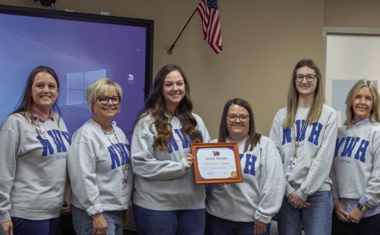 The Northwest Heights Elementary School third grade team was presented a Roar Award for academic achievement in math. From left, Assistant Superintendent Kenny Cha , Mellissa Sherrer, Teenie Baxter, Chelsea Carlock, Lisa Jones, Michaela Mussett, Suzanne Caldwell and Principal Taylor Downs. Matt Swearengin | Durant Democrat