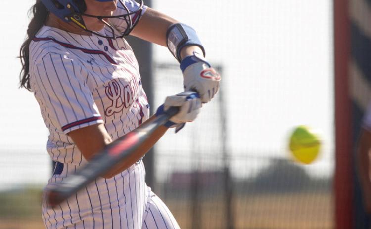 Lady Lion Lylith Harris swing at the ball. Matt Swearengin | Durant Democrat