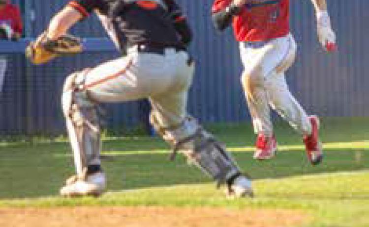 Durant Lion Cole Robbins runs toward home plate during the game with Tahlequah. Matt Swearengin | Durant Democrat
