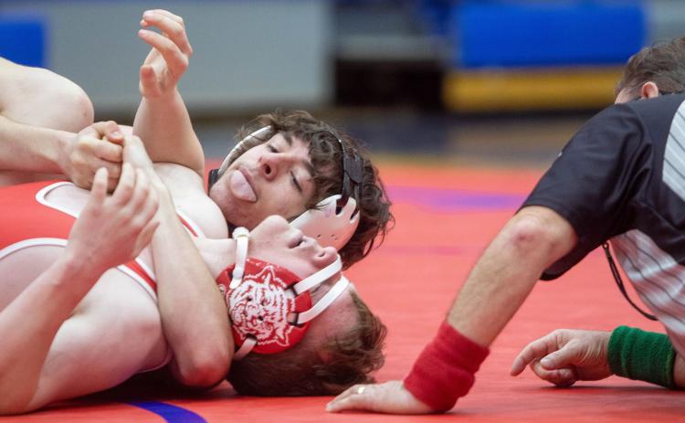 Lion Jon Pierce takes on a Davis wrestler. Matt Swearengin | Durant Democrat