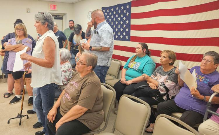 Kasey Cox, middle, attended last week’s meeting of Kingston Council. He was terminated as police chief during a meeting in May and citizens who want him reinstated spoke up before the conclusion of last week’s meeting. Matt Swearengin | Durant Democrat