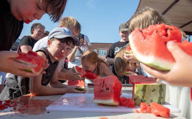ABOVE: The Durant Magnolia Farmers Market Watermelon Jamboree was Saturday morning at Market Square and there was a watermelon eating contest and seed-spitting contest. The Farmers Market continues on Saturdays from 8 a.m. until noon through Oct. 31. See more pictures on page 10.