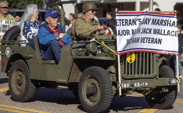 Former Bryan County Sheri_ Ken Golden escorts Parade Marshal Maj. Alvin Jack Wallace in the Veterans Day Parade. Matt Swearengin | Durant Democrat