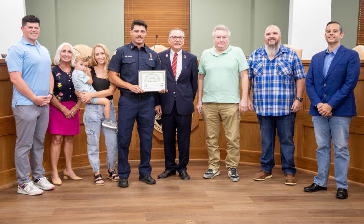 Jacob Argo received a certificate during a Durant City Council meeting last week for his five years of service with the Durant Fire Department. Matt Swearengin | Durant Democrat