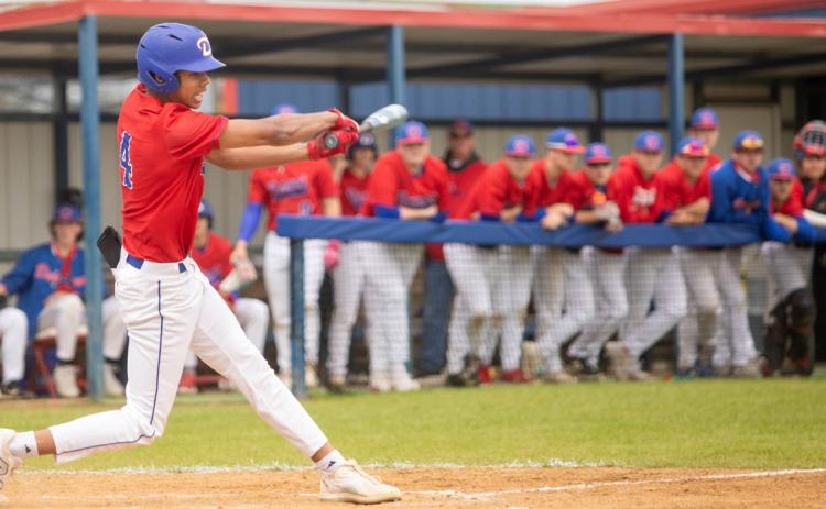 Lion Holdan Robinson swings the bat. Matt Swearengin | Durant Democrat