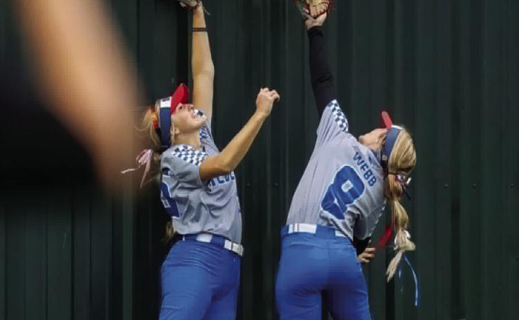 Silo Lady Rebels Neely House and Jayci Webb, lunge for the ball during a state final with Dale. Rick Hester | Lincoln County News