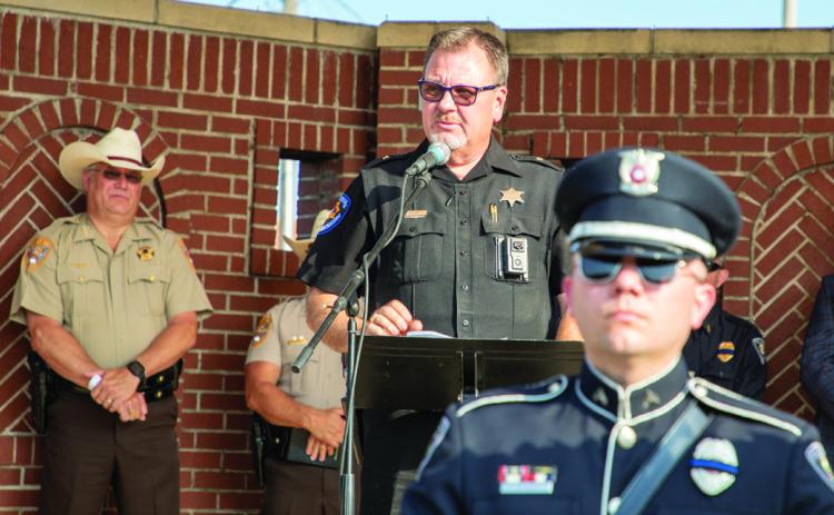 Don Hyde, who has retired as Calera police chief, speaks at a memorial for fallen o_cers. Matt Swearengin | Durant Democrat