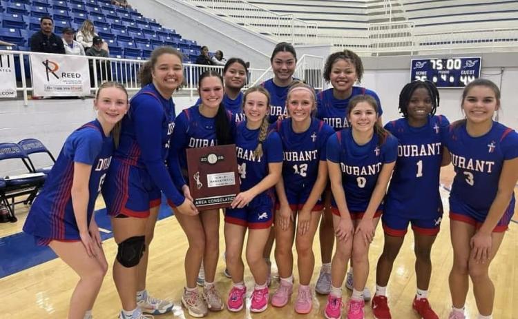 The Durant Lady Lions basketball team poses after defeating Pryor on Friday in Sapulpa. They now will be on their way to the state tournament. 