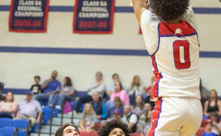 Durant Lion Tashaun Williams scores a slam dunk in last week’s game with Tahlequah. Matt Swearengin | Durant Democrat