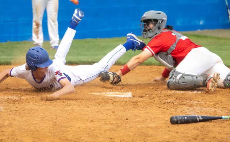 Silo Rebel Blane Beauchamp slides into home plate during the game with Kingston. Matt Swearengin | Durant Democrat