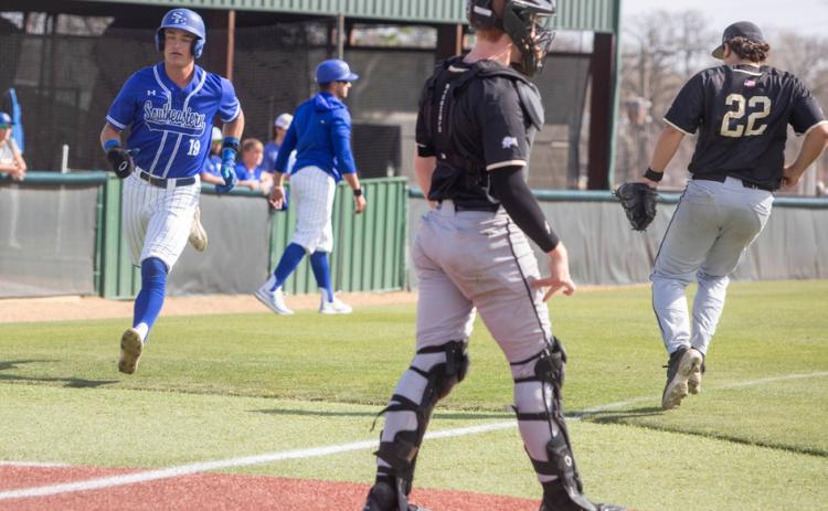SE baseball player Coby Grimsley runs to home plate. Matt Swearengin | Durant Democrat