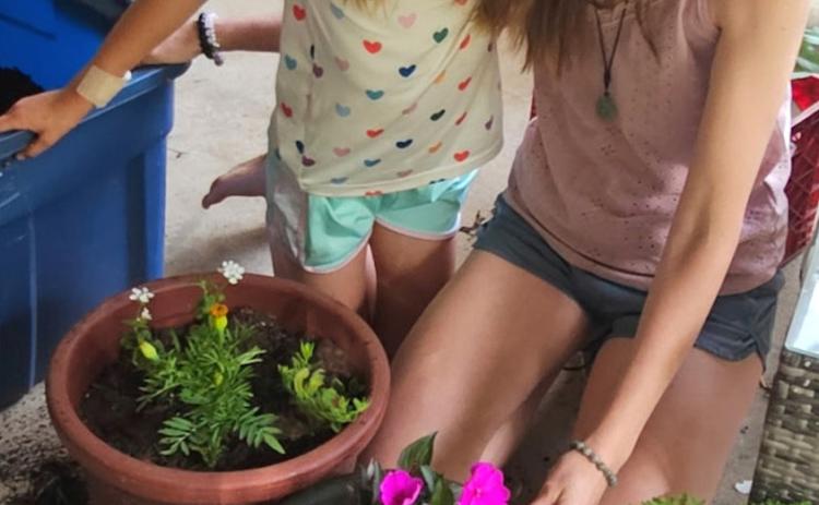 Second grader Aurora Shirey (pictured left) and her mother, Becky Shirey, enjoy gardening together. Aurora recently earned first place in the Oklahoma Virtual Charter Academy elementary school science fair. Photo provided