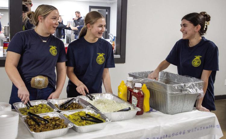 Durant FFA members Bailee Varner, Gentry Phillips and Elliana Partain are shown at the annual chili dinner last week at the Clay Jones Community Center. Matt Swearengin | Durant Democrat