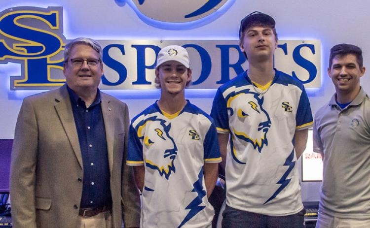 From left, Dr. Thomas W. Newsom, Southeastern President; Christian Vining (“crimsonchin”); Carter Hancock (“gamersity” and Steven Harris, SEsports coordinator. Dan Hoke | SE
