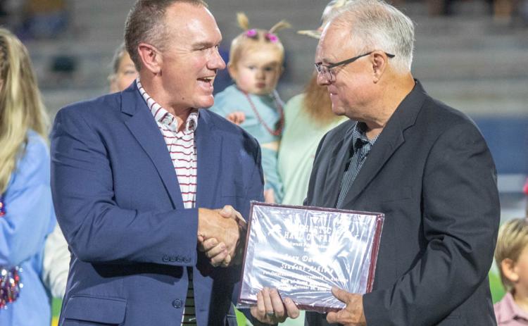 Joey Devault was inducted into the 2024 Durant Athletic Hall of Fame and he was not present for last year’s ceremony, so he was honored last Friday. The 1980 Durant High School graduate was a three-year stalwart in football, basketball and baseball for the Lions as well as completing two years in track, but may be best known as the player that scored the game-winning touchdown for the Lions’ first-ever gridiron championship. Also shown is Durant Schools Superintendent Mark Moring.