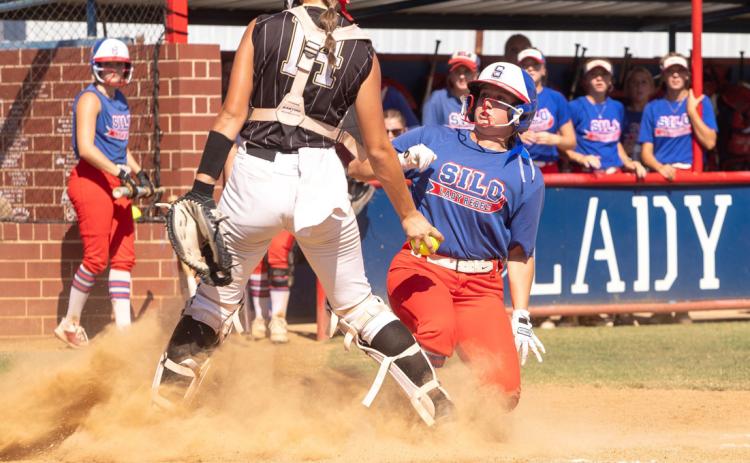 Silo Lady Rebel Paetyn Garrett slides into home plate during a recent game with Lincoln Christian. Matt Swearengin | Durant Democrat